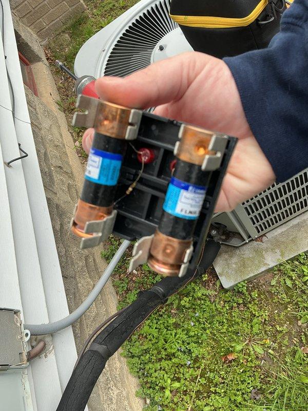 Completed annual cooling maintenance on residential HVAC system. Inspected and photographed electrical disconnect with fuses, verified proper operation and secure connections. Checked refrigerant service valves on outdoor condensing unit, confirmed valve integrity and proper sealing. Performed standard ACM protocol including visual inspection of condenser unit, verified fan operation, and assessed overall system condition. All components functioning within normal parameters, no immediate repairs required.