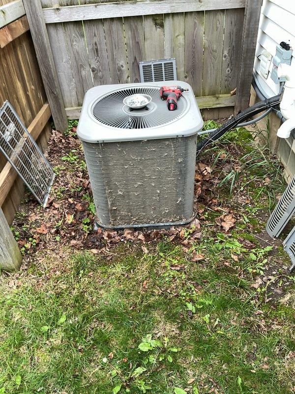 Completed annual HVAC maintenance inspection on outdoor condensing unit. Performed standard ACM service protocol including system evaluation, cleaning of condenser coils, and operational testing. Unit was found to be functional with normal operating parameters. Cleared accumulated debris including leaves and organic matter from around the equipment base and concrete pad to ensure proper airflow and drainage. Verified electrical connections, refrigerant levels, and overall system performance met manufacturer specifications.