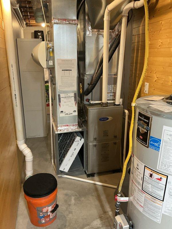 Completed annual HVAC maintenance on Carrier system in basement mechanical room, including replacement of 20x25x5 pleated air filter which showed significant dust accumulation. Inspected all equipment, ductwork connections, and utility components to ensure proper operation and system efficiency.