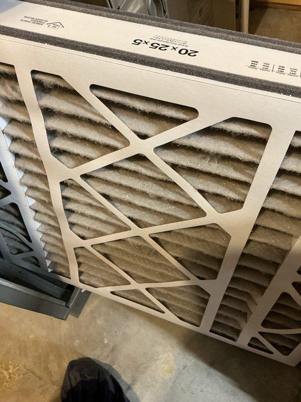 Completed annual HVAC maintenance on Carrier system in basement mechanical room, including replacement of 20x25x5 pleated air filter which showed significant dust accumulation. Inspected all equipment, ductwork connections, and utility components to ensure proper operation and system efficiency.