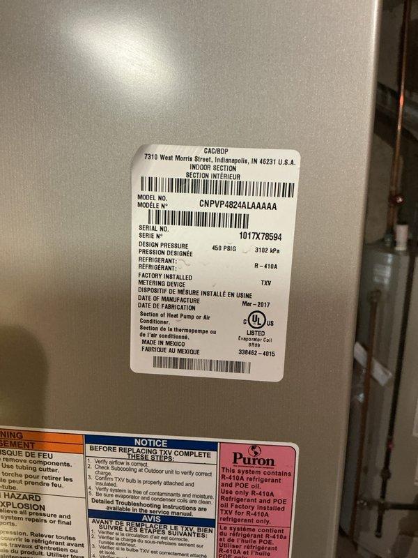 Completed annual cooling maintenance on Carrier CNPVU4824ALAA4AA unit (March 2017 manufacture, R-410A refrigerant). Performed comprehensive system inspection, verified unit specifications and TXV metering device operation, and measured capacitor at 15.62 MFD to confirm proper electrical component function.