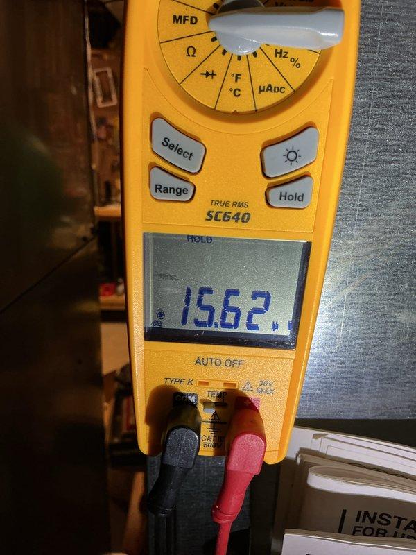 Completed annual cooling maintenance on Carrier CNPVU4824ALAA4AA unit (March 2017 manufacture, R-410A refrigerant). Performed comprehensive system inspection, verified unit specifications and TXV metering device operation, and measured capacitor at 15.62 MFD to confirm proper electrical component function.
