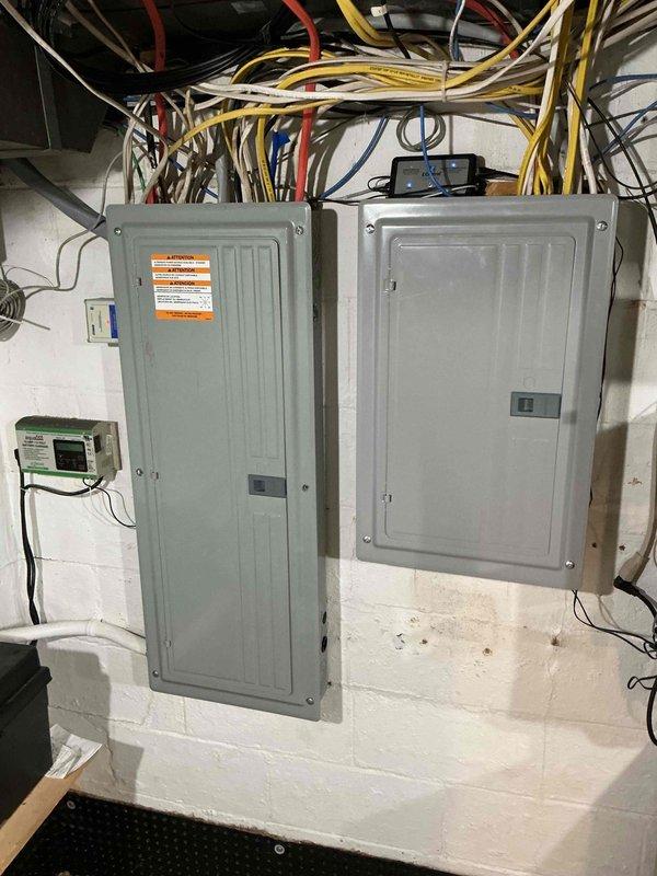 Installed 200-amp automatic transfer switch with dual electrical panel configuration on prepared concrete block wall. Coordinated installation with local utility provider and building department to ensure proper permitting and inspection compliance. Completed all electrical connections, verified proper operation of transfer switch mechanism, and documented installation with photographic records per standard procedures.