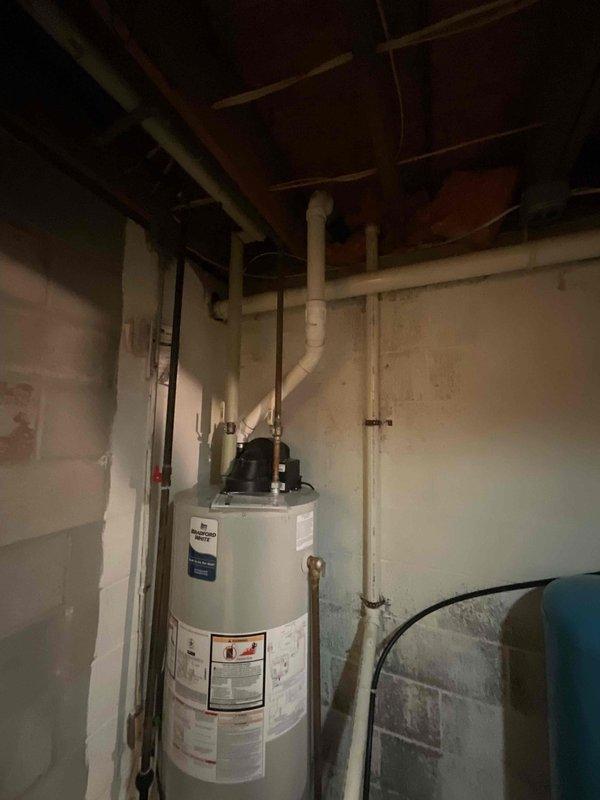 Conducted on-site evaluation for new Kohler whole home generator installation. Assessed existing electrical infrastructure, utility access points, and optimal placement location for generator unit. Documented current mechanical systems including water heater and utility room configuration to determine electrical load requirements and integration specifications for the proposed standby generator system.
