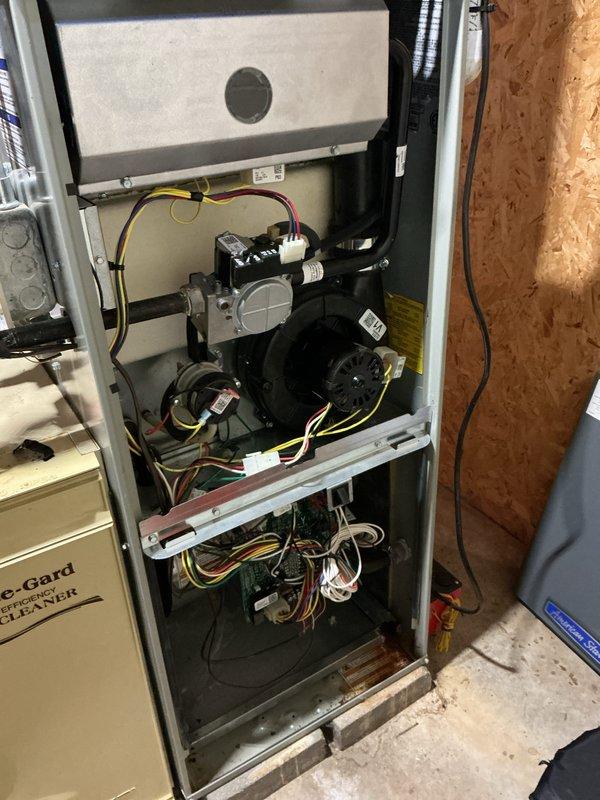 Completed routine maintenance on residential forced air furnace and air conditioning system. Performed comprehensive AC tune-up including inspection of blower motor assembly, gas valve components, electrical connections, and control wiring. Verified proper operation of all mechanical and electrical components within the air handler unit. Inspected ductwork connections, PVC condensate lines, and electrical panel connections. All systems tested and confirmed operating within normal parameters with no deficiencies noted at time of service.