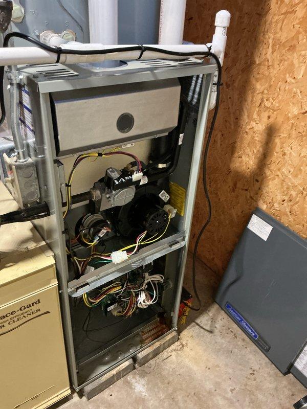 Completed routine maintenance on residential forced air furnace and air conditioning system. Performed comprehensive AC tune-up including inspection of blower motor assembly, gas valve components, electrical connections, and control wiring. Verified proper operation of all mechanical and electrical components within the air handler unit. Inspected ductwork connections, PVC condensate lines, and electrical panel connections. All systems tested and confirmed operating within normal parameters with no deficiencies noted at time of service.