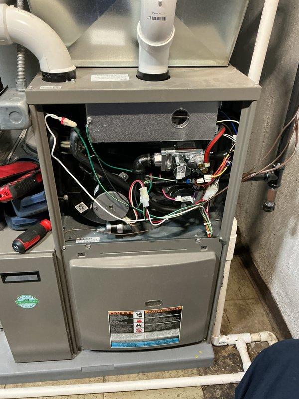 Completed comprehensive tune-up and safety inspection on 2-year-old gas furnace located in basement. Performed thorough examination of all internal components including gas valve assembly, pressure switches, electrical connections, and wire harnesses. Inspected humidifier, thermostat operation, and hot water tank as part of standard maintenance protocol, verifying all systems operating within normal parameters.