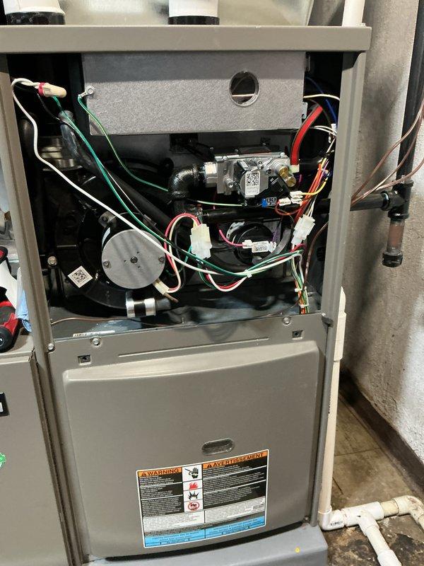 Completed comprehensive tune-up and safety inspection on 2-year-old gas furnace located in basement. Performed thorough examination of all internal components including gas valve assembly, pressure switches, electrical connections, and wire harnesses. Inspected humidifier, thermostat operation, and hot water tank as part of standard maintenance protocol, verifying all systems operating within normal parameters.