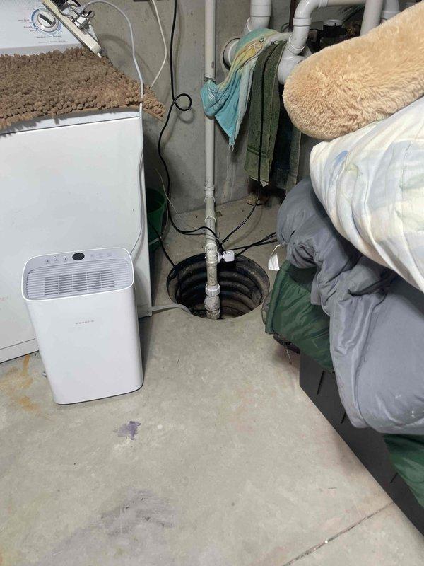 Conducted site assessment for new Kohler whole home generator installation. Evaluated basement utility area to determine optimal equipment placement, electrical service capacity, and required infrastructure modifications. Documented existing electrical panel configuration with multiple circuit wiring and conduit routing. Assessed concrete floor conditions, available clearances, and proximity to existing plumbing and mechanical systems including sump pump pit and drainage infrastructure. Identified suitable location for generator transfer switch installation and determined pathway for required electrical conduit runs from main service panel to proposed exterior generator pad location.