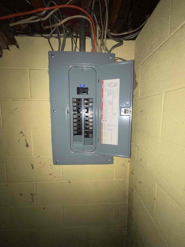 Provided estimate for replacement of 8-year-old non-operational natural gas furnace and air conditioning system located in basement under buy-one-get-one promotion. Assessed existing electrical service entrance, utility meter installation, and basement electrical panel with multiple circuit breakers to verify adequate power supply and proper grounding for new HVAC equipment installation.