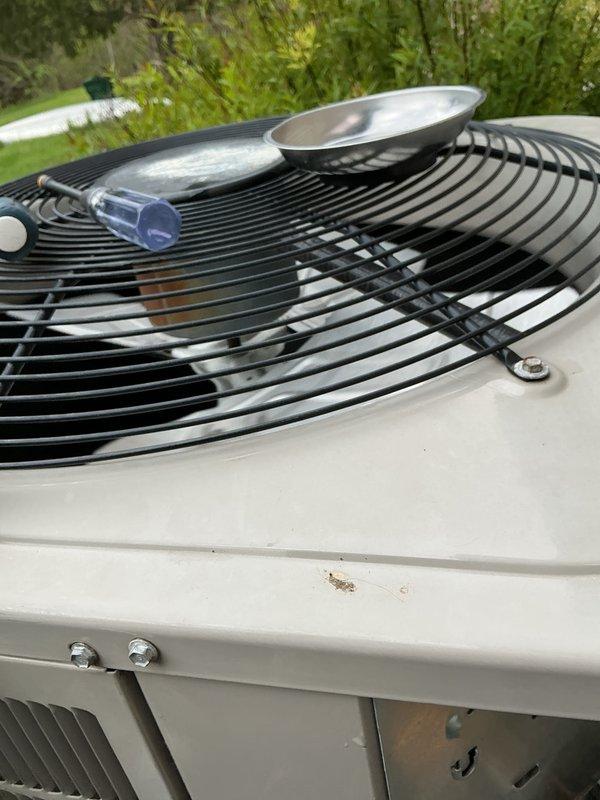 Completed scheduled air conditioning maintenance on outdoor condensing unit. Performed refrigerant pressure diagnostics using manifold gauge set, inspected condenser coil condition, and verified proper system operation. Unit operational with no deficiencies noted at time of service.
