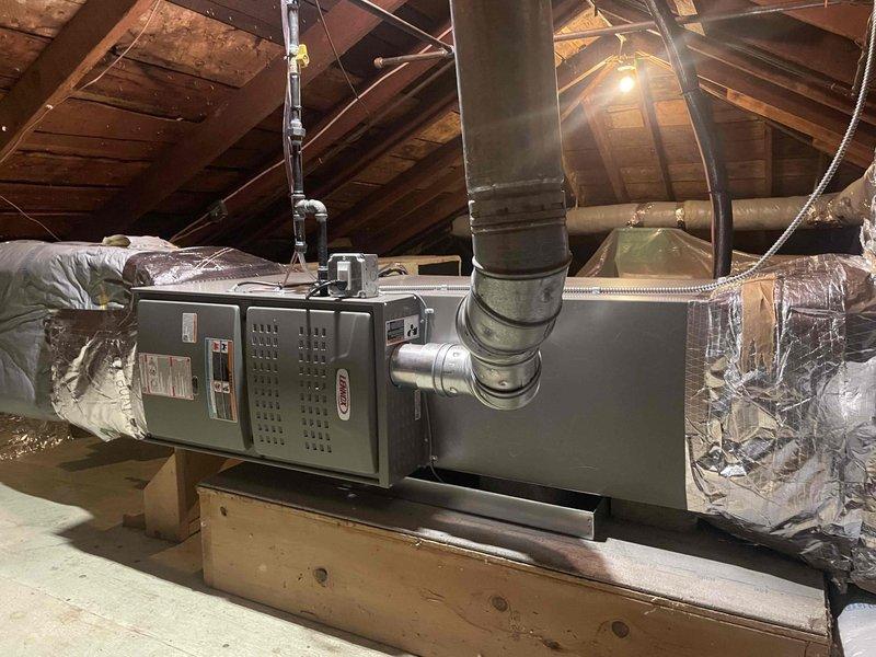 Completed full HVAC system installation consisting of one 70,000 BTU Lennox furnace installed in attic space on properly constructed wooden platform with vertical and horizontal ductwork connections, plus two 2-ton air conditioning units for dual-zone cooling. Performed mechanical and electrical rough-in work, installed two new dedicated electrical circuits to code for equipment operation, and positioned second furnace unit in basement utility area with appropriate condensate drainage, PVC venting, and metal supply ductwork. All units secured on stable platforms, ductwork properly sealed and insulated, electrical connections completed, and systems tested for proper operation.