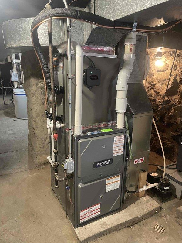 Completed full HVAC system installation consisting of one 70,000 BTU Lennox furnace installed in attic space on properly constructed wooden platform with vertical and horizontal ductwork connections, plus two 2-ton air conditioning units for dual-zone cooling. Performed mechanical and electrical rough-in work, installed two new dedicated electrical circuits to code for equipment operation, and positioned second furnace unit in basement utility area with appropriate condensate drainage, PVC venting, and metal supply ductwork. All units secured on stable platforms, ductwork properly sealed and insulated, electrical connections completed, and systems tested for proper operation.