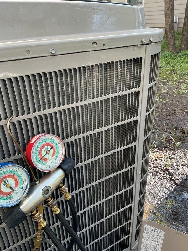 Performed annual cooling maintenance on outdoor condensing unit. Connected manifold gauges to measure refrigerant pressures and verified system operating parameters. Inspected condenser coil fins for proper airflow and noted unit condition for maintenance records.