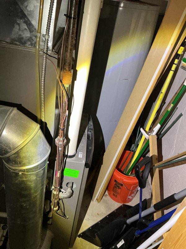 Completed comprehensive annual air conditioning maintenance and tune-up service under prepaid year-round care plan. Performed full system inspection of residential AC unit and air handler located in basement utility area. Inspected all mechanical components, ductwork connections, refrigerant lines, and electrical connections. Verified proper airflow through supply and return ducts. Checked condensate drain system for proper operation and drainage. Tested system controls and thermostat communication. System found operating within normal parameters with no deficiencies noted. All components functioning properly at time of service. Documented equipment condition with photos for service records. Unit ready for continued operation through cooling season.