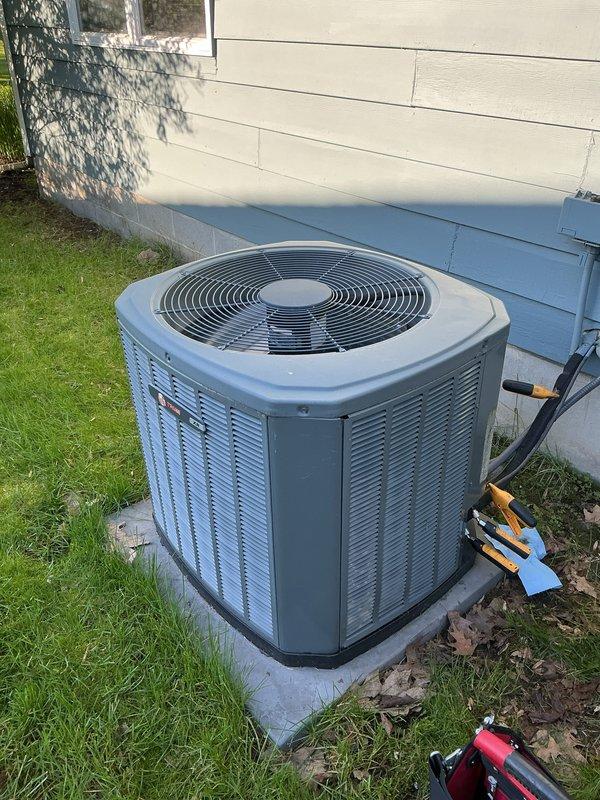 Completed annual preventative maintenance on residential air conditioning system. Performed comprehensive inspection of outdoor condenser unit, including visual assessment of cabinet condition, fan operation, and refrigerant line connections. Verified proper unit placement on concrete pad and checked electrical connections at exterior wall penetration. Tested system operation and documented equipment condition with photographic records. All components found operating within normal parameters with no immediate service needs identified.