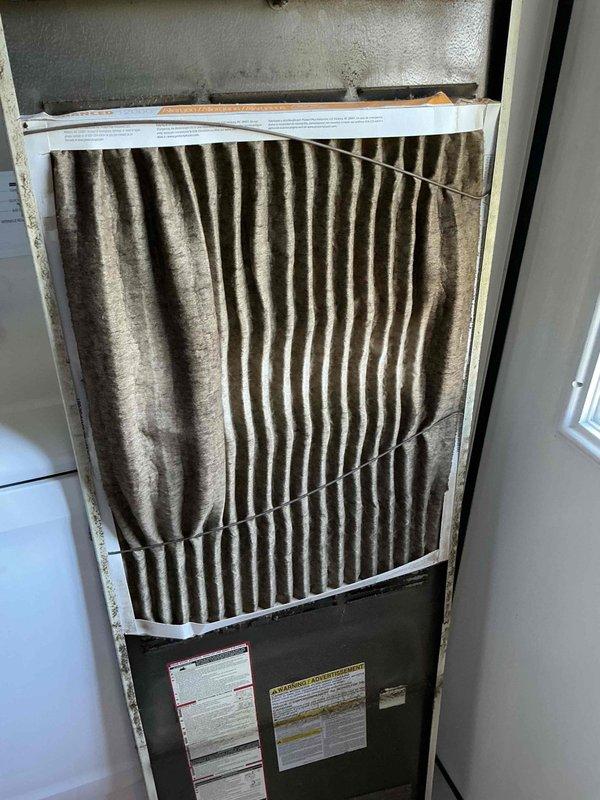 Responded to no heat call on forced air furnace system. Upon arrival, found furnace tripping circuit breaker and unable to maintain operation. Inspection revealed severely clogged air filter with heavy dust and debris accumulation, restricting airflow and causing system to overheat and trip safety controls. Replaced dirty pleated filter with new filter. Cleared tripped breaker and restarted system. Verified proper airflow through supply vents, confirmed ignition sequence, and monitored furnace through complete heating cycle. System now operating normally with adequate heat distribution throughout home. Advised homeowner on importance of regular filter maintenance every 1-3 months to prevent future overheating issues and system shutdowns.