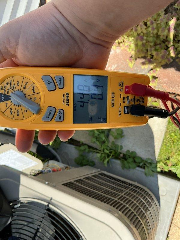 Performed annual cooling maintenance on residential air conditioning system. Conducted electrical diagnostics using digital multimeter to verify system operation and measure capacitance values. Unit requires replacement evaporative cooler pads to maintain optimal performance and efficiency.