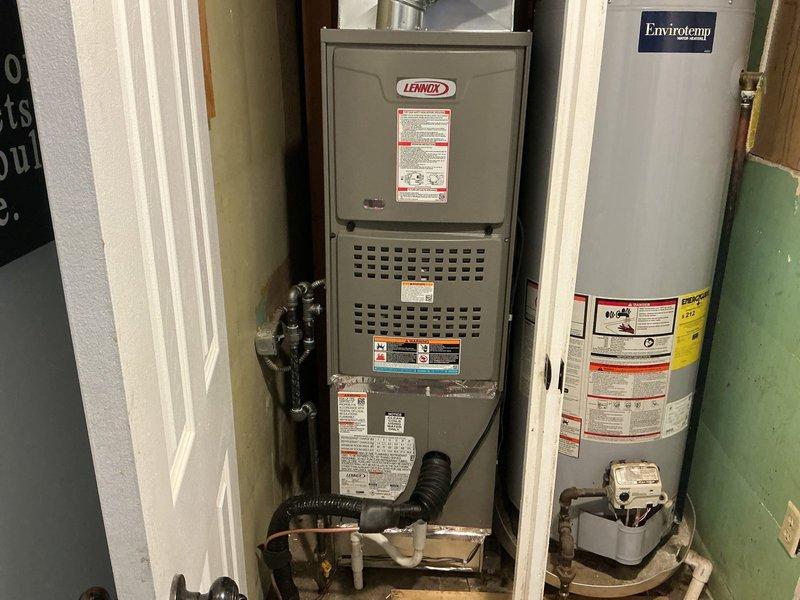 Completed full HVAC system installation including a 45,000 BTU Lennox furnace and 1.5-ton air conditioning unit in residential utility closet. Installation included all mechanical and electrical connections, new dedicated electrical circuit, right-side configuration, and PVC condensate drainage lines. System tested and operational upon completion.