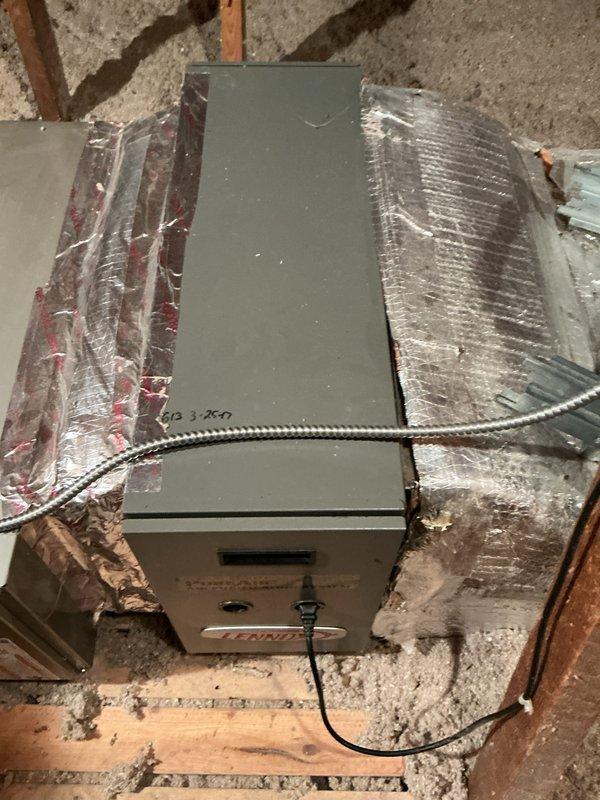 Completed annual cooling maintenance on attic-installed air handler unit. Performed system inspection, changed air filter, and documented equipment condition with photos showing unit properly installed in attic space with adequate ductwork connections and insulation in place.