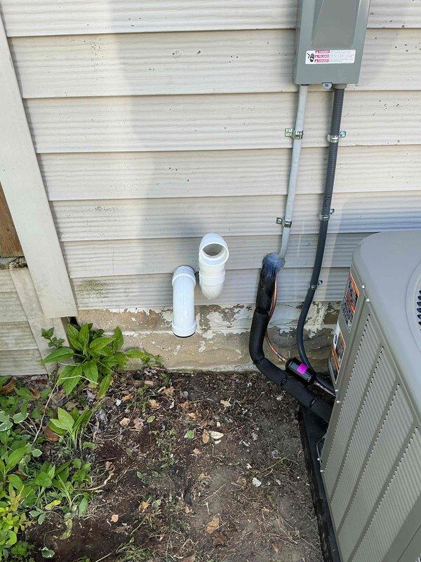 Completed full HVAC system installation including a 70,000 BTU furnace and 3.5-ton air conditioning unit with right-side configuration. Installed new flue liner, ran and secured refrigerant lines along exterior wall with proper insulation and mounting straps, and installed electrical disconnect box with conduit connection to outdoor unit. Connected PVC condensate drain line and mounted at foundation level. Reconnected all electrical and gas connections per manufacturer specifications. Verified proper system operation and refrigerant charge on Lennox model 543GCT-30B-71 outdoor unit. All components installed to code and system tested successfully.