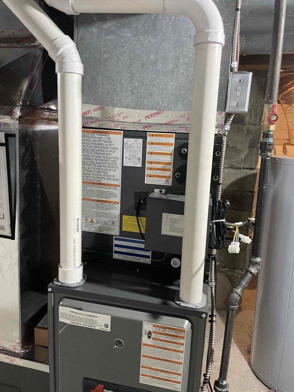 Provided estimate for air conditioning system replacement in basement location where no current A/C unit exists. Assessed installation site featuring existing furnace with PVC venting, concrete block walls, and available space for new equipment placement. Evaluated electrical infrastructure including panel box and wiring capacity, reviewed ductwork configuration with existing metallic supply ducts, and confirmed basement access and clearances for proper equipment installation and future service requirements.