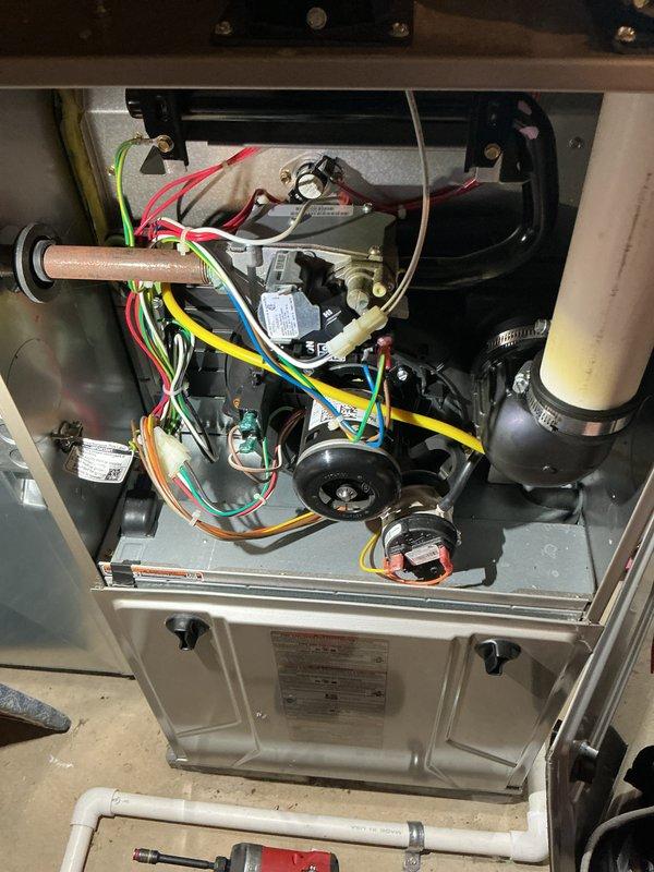 Performed comprehensive furnace tune-up including full system inspection with access panel removal, cleaned and inspected blower assembly and internal components, checked all electrical connections and wiring harnesses, verified proper operation of combustion components, and inspected condensate drainage system. All components found operating within manufacturer specifications and unit returned to normal service.