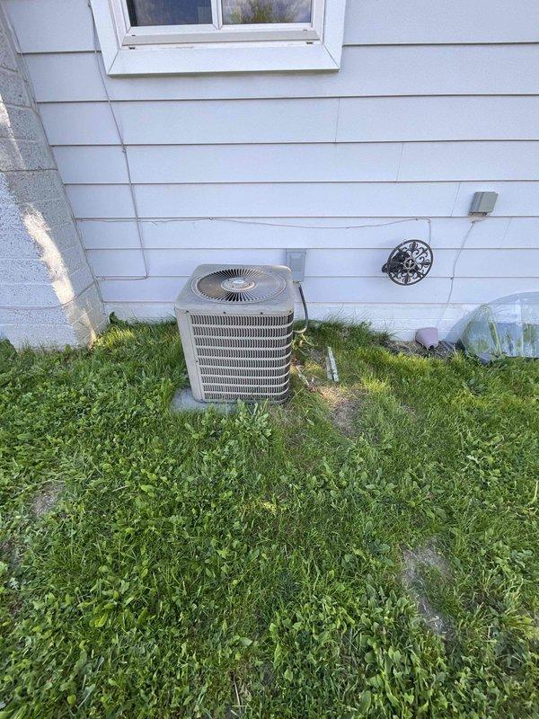 Conducted comprehensive site assessment for HVAC system replacement estimate on 30+ year old natural gas furnace located in basement and outdoor air conditioning condenser unit. Evaluated existing equipment condition, electrical panel capacity, installation accessibility, and documented current system configuration including outdoor AC unit positioned on concrete pad with adequate clearance and basement-mounted furnace with accessible gas supply. Provided replacement recommendations for complete heating and cooling system upgrade to improve efficiency and reliability.