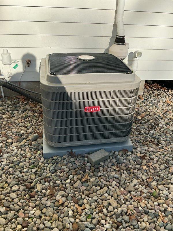 Completed annual cooling maintenance on Bryant outdoor condensing unit. Performed comprehensive system inspection, verified refrigerant lines and electrical disconnect in proper working condition, confirmed unit operational with no deficiencies noted. Equipment found clean and functioning normally on rock pad foundation with proper drainage.