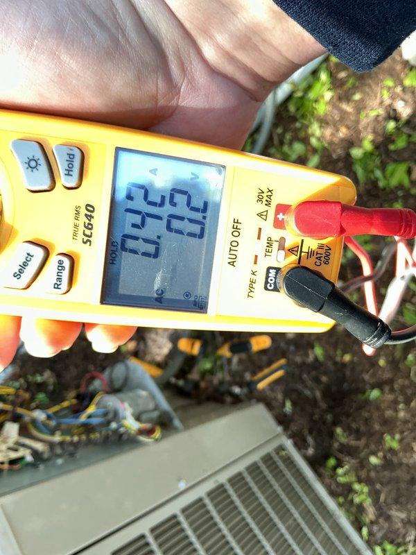 Completed annual cooling maintenance on outdoor HVAC unit. Performed electrical diagnostics using digital multimeter, recording voltage readings of 24V at low voltage controls and 52-65V at capacitor terminals. Inspected internal wiring connections and terminal blocks, confirming all connections secure and properly terminated with no signs of overheating or corrosion.