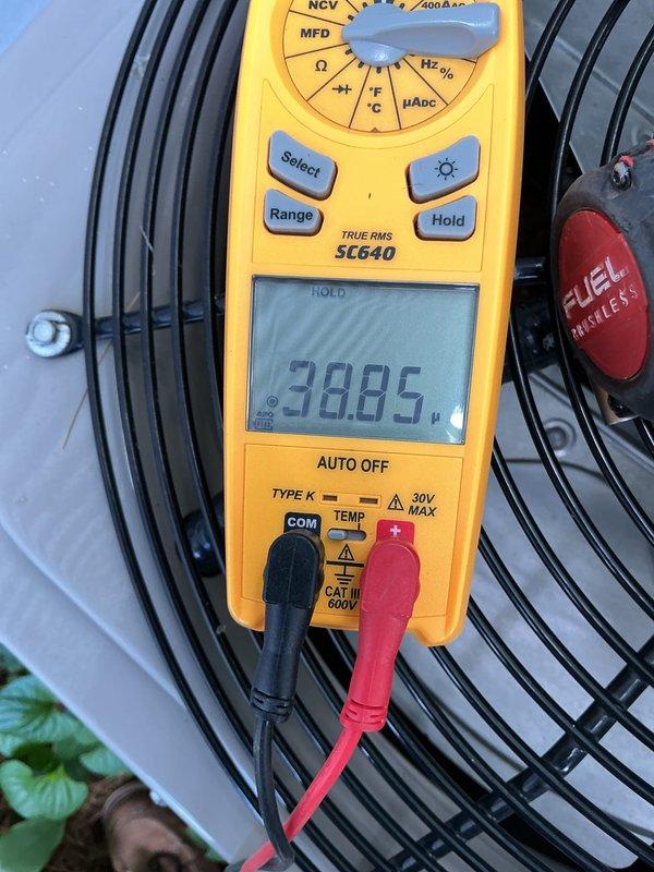 Completed annual cooling maintenance on HVAC system. Performed comprehensive inspection of condenser unit, measured and recorded run capacitor at 38.85 microfarads to verify proper operation, checked electrical connections, and tested fan motor functionality. All components operating within normal parameters with no deficiencies noted.