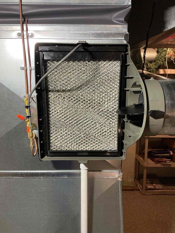 Responded to service call for 3-year-old furnace in basement with red indicator light, inadequate heating performance, and excessive dust distribution throughout home. Upon inspection, found air filtration system with compromised mesh filter requiring attention. Evaluated HVAC system including ductwork, copper refrigerant lines, and air handler components. Addressed airflow restrictions affecting system performance and indoor air quality. Verified proper operation of damper controls and blower assembly. System restored to normal operating parameters with improved air circulation and filtration efficiency.