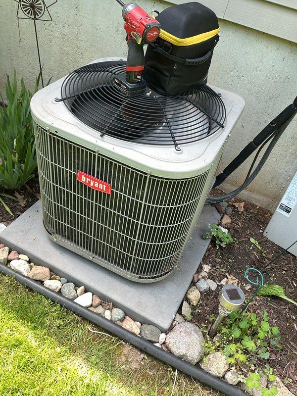 Completed annual cooling maintenance on Bryant air conditioning system. Identified humidifier pad requiring replacement and obtained customer approval for part. Performed standard ACM protocol including electrical diagnostics with multimeter readings, visual inspection of condenser unit, and verification of system operation. Unit running properly upon completion of service.