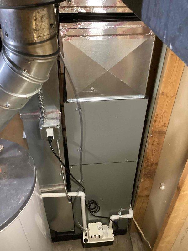 Completed full HVAC system installation including a 70,000 BTU gas furnace and 2-ton air conditioning unit in basement mechanical room. Installed new air handler with left-side configuration, connected all refrigerant lines, installed ductwork transitions, and established proper condensate drainage system. Verified all electrical connections, tested system operation, and confirmed proper airflow throughout the residence.