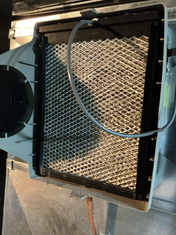 Completed annual cooling maintenance inspection on HVAC system. Inspected air handler unit, verified proper operation of blower assembly and refrigerant lines, and examined filter housing with expanded metal mesh grille. All components found in functional condition with normal wear patterns observed.