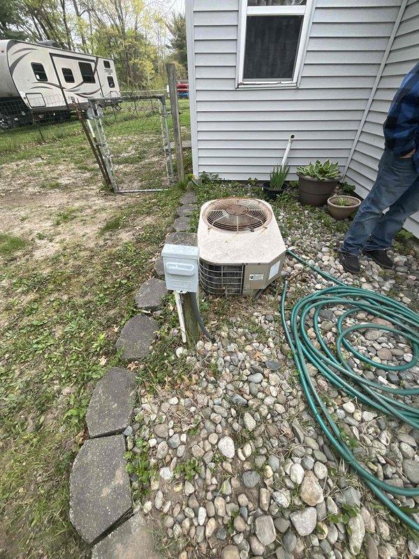 Provided estimate for complete HVAC system replacement including natural gas furnace and air conditioning unit for 25-year-old equipment located in attic space. Current air conditioning unit is non-operational while furnace remains functional. Assessed existing flexible ductwork configuration in attic and outdoor condenser unit placement on gravel pad adjacent to white vinyl siding, documented system layout and equipment access for proposed replacement installation.