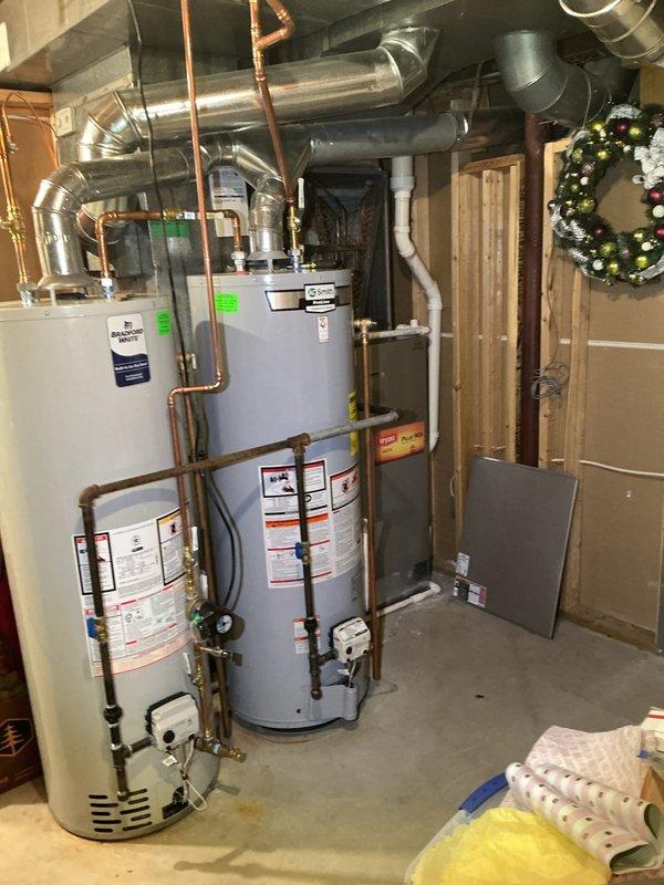 Completed annual cooling maintenance on residential HVAC system located in basement utility area. Performed comprehensive inspection of air handler unit with multi-panel filter assembly, verified proper airflow through slatted filter banks, and assessed ductwork distribution network throughout the space. Inspected all mechanical connections, copper refrigerant lines, electrical components, and confirmed system operational readiness for upcoming cooling season.