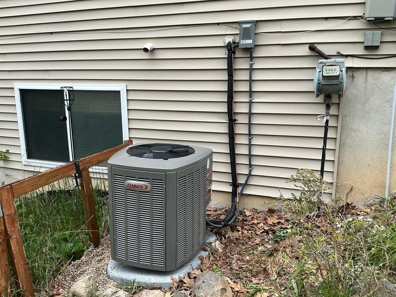 Completed full HVAC system installation including a 70,000 BTU gas furnace (Lennox model CK40CT-24B-71) and 2-ton air conditioning unit positioned on left side of residence. Installed outdoor condensing unit on concrete pad with proper electrical disconnect, reconnected all necessary utilities including gas and electrical service, and verified all connections meet manufacturer specifications and local code requirements.