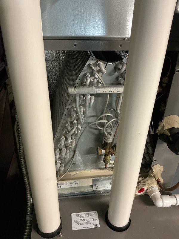 Completed annual cooling maintenance on Lennox HVAC system. Performed thorough inspection of evaporator coil assembly, verified proper refrigerant line connections, and documented system condition with all components functioning properly and installation meeting manufacturer specifications.