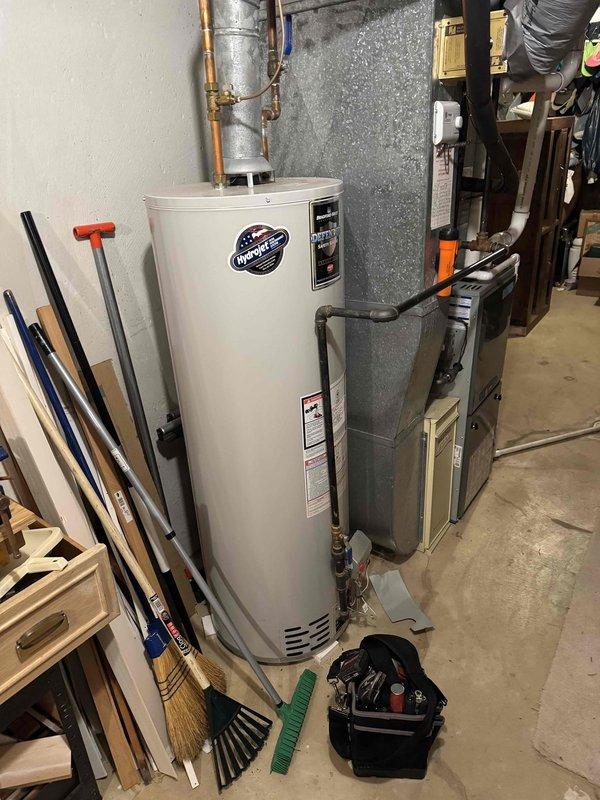 Responded to no hot water complaint at residential property. Upon arrival, inspected 7-year-old Bradford White tanked water heater in basement utility area. Customer reported unit was producing hot water the previous morning but only cold water by evening, indicating sudden failure. Diagnosed issue and completed necessary repairs to restore hot water functionality. Unit tested and confirmed operational before departure.