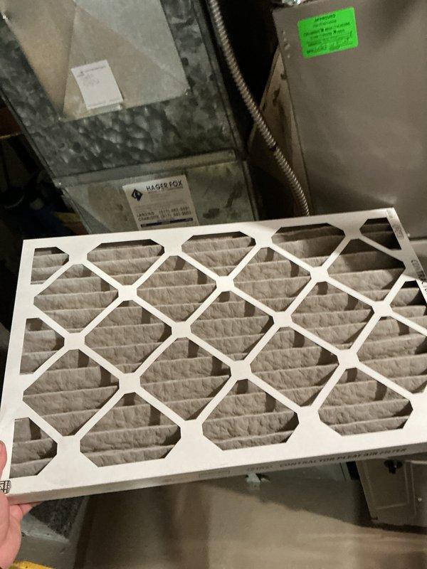 Completed comprehensive AC tune-up on new system with no reported issues. Performed standard maintenance including air filter replacement with new pleated media filter, verified proper system operation, and tested electrical voltage readings which measured 24.53 volts, confirming correct low-voltage control circuit operation.