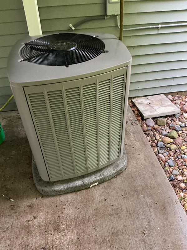 Completed annual preventative maintenance on 3-year-old residential central air conditioning system. Performed comprehensive AC tune-up including inspection of outdoor condenser unit, verification of refrigerant lines, cleaning of condenser coils, and testing of fan operation. System found operating within normal parameters with no deficiencies noted; unit properly secured on concrete pad with adequate clearance for airflow and future service access.
