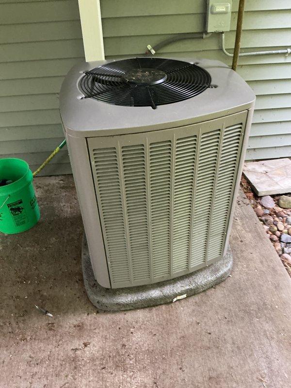 Completed annual preventative maintenance on 3-year-old residential central air conditioning system. Performed comprehensive AC tune-up including inspection of outdoor condenser unit, verification of refrigerant lines, cleaning of condenser coils, and testing of fan operation. System found operating within normal parameters with no deficiencies noted; unit properly secured on concrete pad with adequate clearance for airflow and future service access.