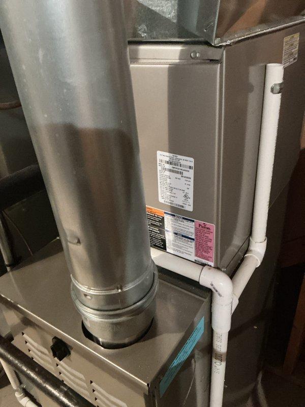 Completed annual cooling maintenance on residential HVAC system. Inspected air handler unit, ductwork, and return air grille. Identified filter requiring replacement and noted spot maintenance needed. Documented equipment condition with photos showing air handler cabinet, condensate drain line, and return grille assembly for service records.