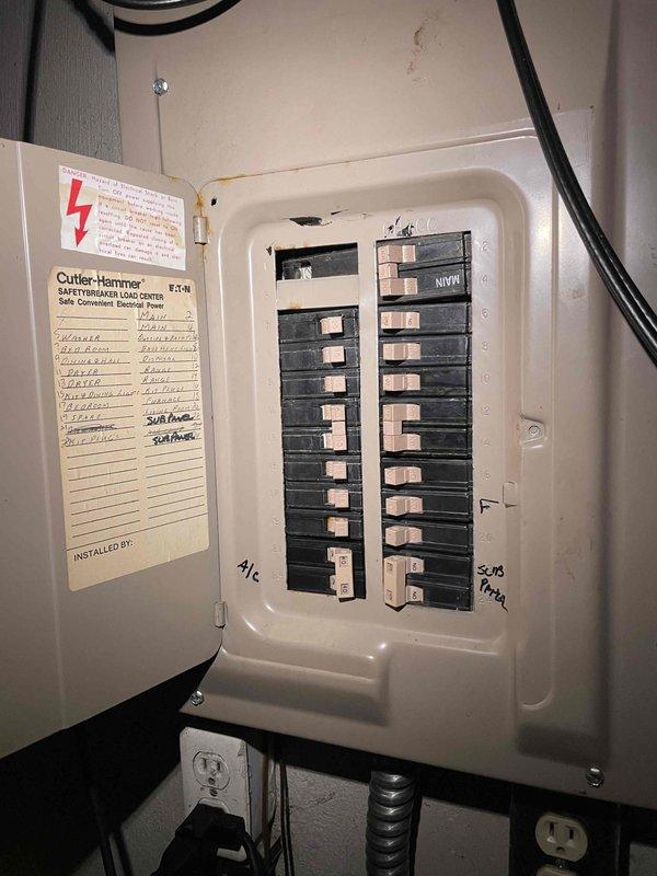 Conducted comprehensive site evaluation for air conditioning system replacement at residential property. Assessed existing outdoor AC unit currently in operational condition, documented electrical infrastructure including sub-panel with Cutler-Hammer load center, and inspected basement mechanical room housing Bryant furnace, air handler, ductwork, and associated PVC venting systems. Provided replacement estimate options based on current system configuration and electrical capacity.