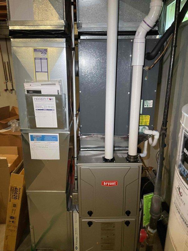 Conducted comprehensive site evaluation for air conditioning system replacement at residential property. Assessed existing outdoor AC unit currently in operational condition, documented electrical infrastructure including sub-panel with Cutler-Hammer load center, and inspected basement mechanical room housing Bryant furnace, air handler, ductwork, and associated PVC venting systems. Provided replacement estimate options based on current system configuration and electrical capacity.
