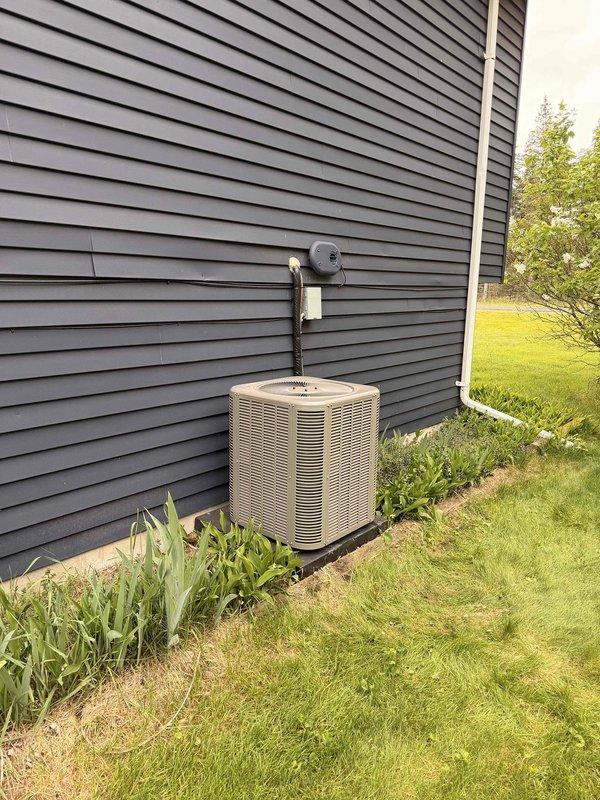 Successfully completed installation of a 2-ton air conditioning system with evaporator coil, including establishment of a new dedicated electrical circuit with disconnect box and proper conduit routing. The condensing unit was positioned on a level pad against the exterior wall with left-side configuration, and all mechanical and electrical permits were obtained prior to installation. System was commissioned, tested for proper operation, and documentation was finalized upon completion.