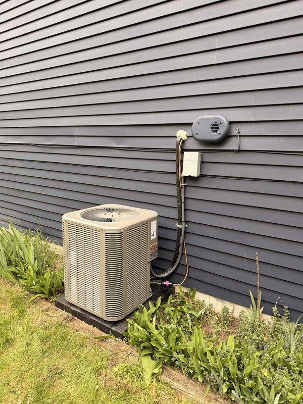 Successfully completed installation of a 2-ton air conditioning system with evaporator coil, including establishment of a new dedicated electrical circuit with disconnect box and proper conduit routing. The condensing unit was positioned on a level pad against the exterior wall with left-side configuration, and all mechanical and electrical permits were obtained prior to installation. System was commissioned, tested for proper operation, and documentation was finalized upon completion.