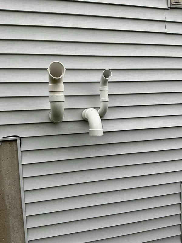 Completed full HVAC system installation including a 70,000 BTU furnace with right-side configuration, 2.5-ton air conditioning unit, and humidifier. Installed outdoor condenser unit on equipment pad with proper refrigerant line connections and electrical disconnect. Configured PVC exhaust and intake venting through exterior wall for high-efficiency furnace operation. Reconnected all necessary utilities and verified system operation upon completion.