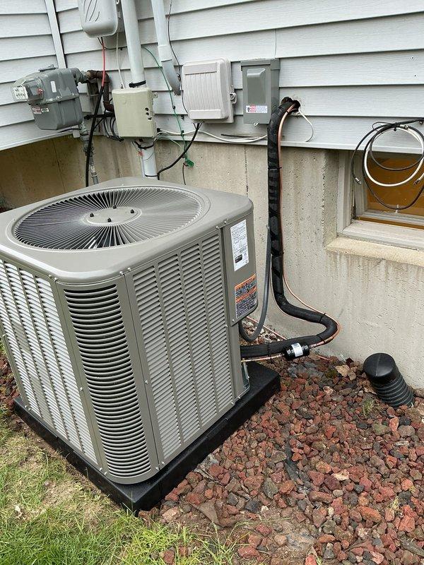 Completed full HVAC system installation including a 70,000 BTU furnace with right-side configuration, 2.5-ton air conditioning unit, and humidifier. Installed outdoor condenser unit on equipment pad with proper refrigerant line connections and electrical disconnect. Configured PVC exhaust and intake venting through exterior wall for high-efficiency furnace operation. Reconnected all necessary utilities and verified system operation upon completion.